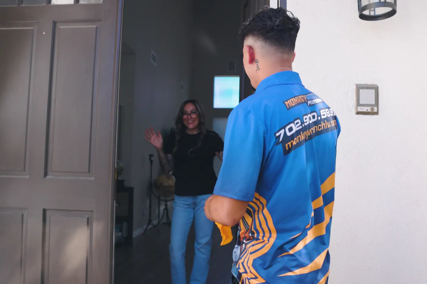A Monkey Wrench technician arriving at the door of a Las Vegas home
