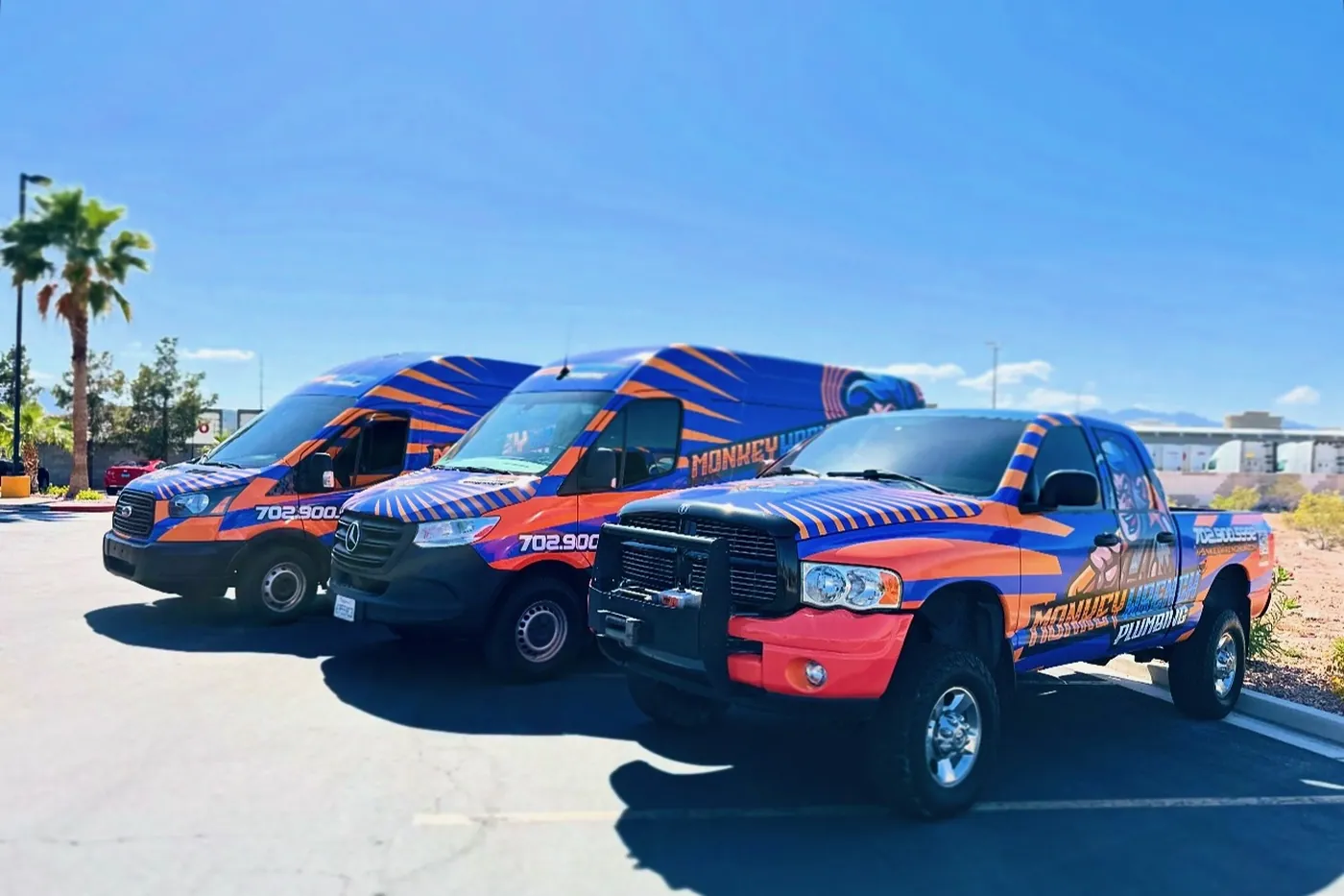 The Monkey Wrench Plumbing fleet of wrapped vans and trucks in Las Vegas